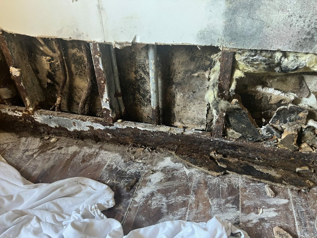 a wall with mold and water damage