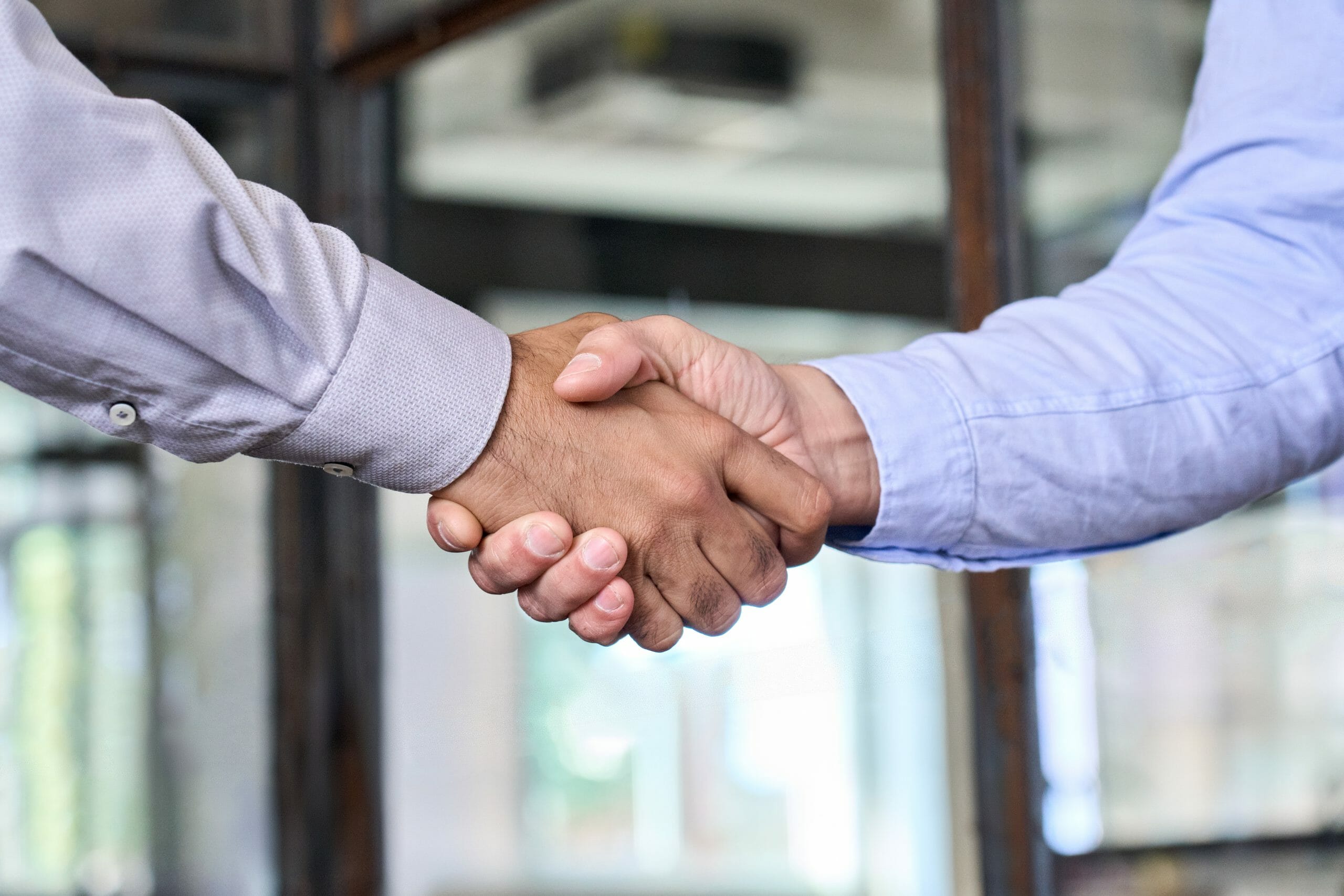 two-businessmen-shake-hands